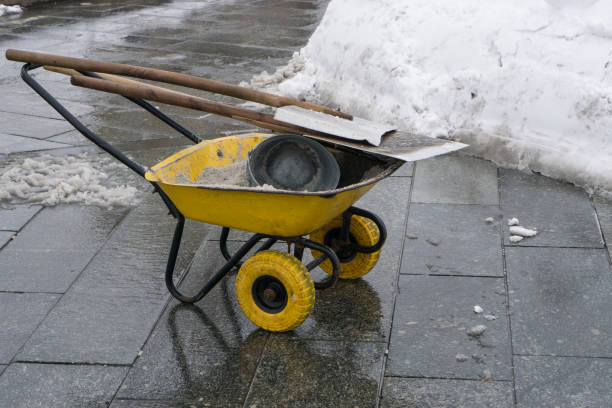 istock snow cleaning tools - wheelbarrow, bucket and shovel 945032814