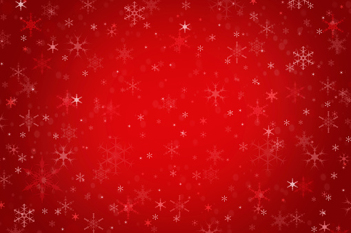 Abstract maroon red Christmas holiday winter background of falling snow bokeh and snowflakes