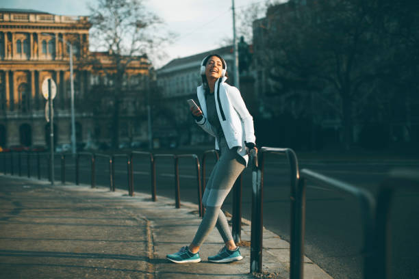 istock Young female athlete taking break from running workout 945041484