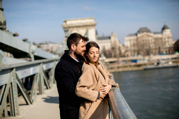 istock Loving couple on Chain bridge, Budapest 945042080