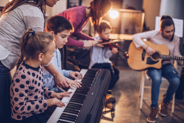 istock Kids teaching to play music 945042168