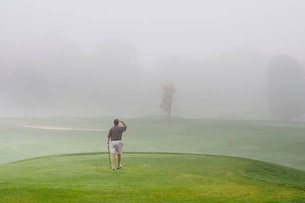 istock Golfer on Foggy Course Poor Visibility 94504393
