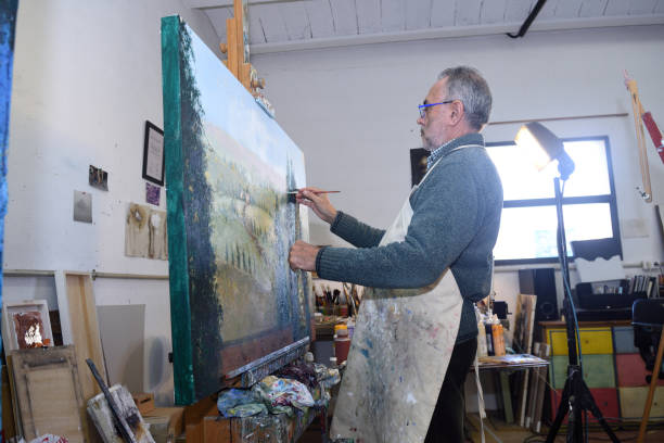 istock portrait of a painter artist who works in his studio 945048894