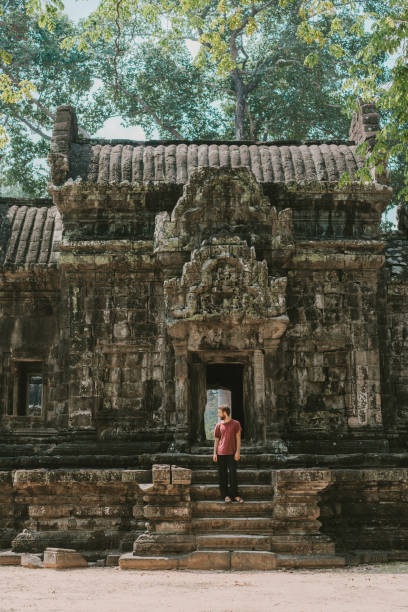 istock Man sitting  in Angkor Temple in Cambodia 945049038