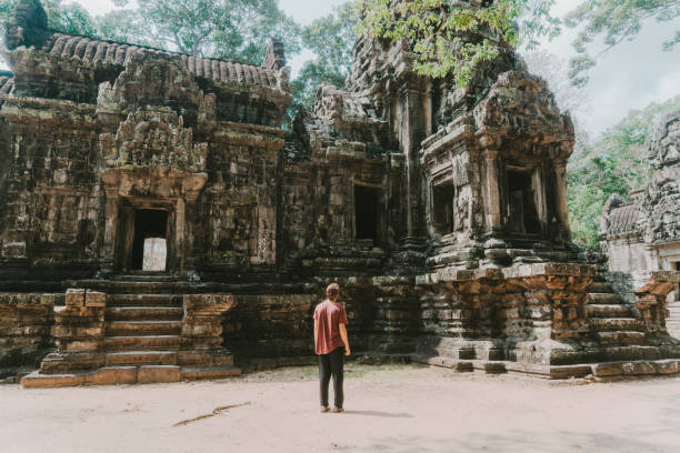 istock Man walking in Angkor Temple in Cambodia 945049040