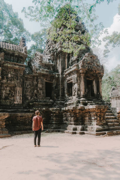 istock Man walking in Angkor Temple in Cambodia 945049072