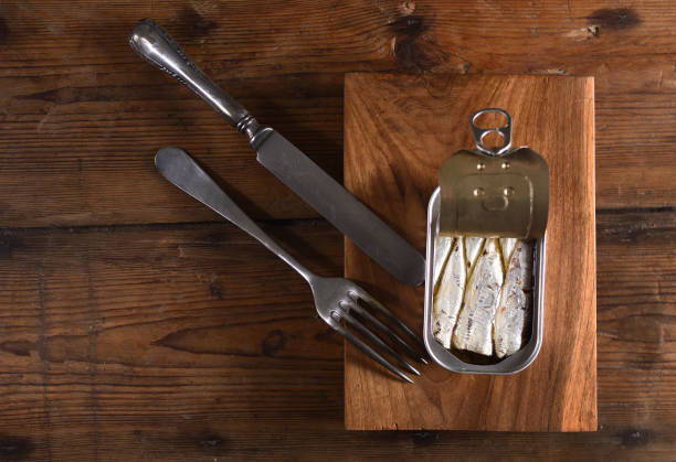 istock canned sardine on wooden table 945050224