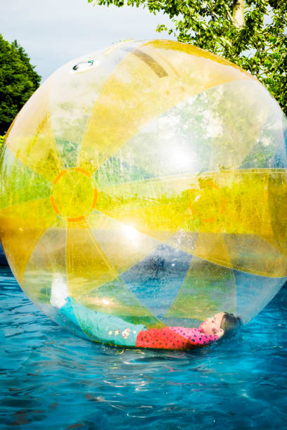 istock Young Girl Lying in Ball 945053674