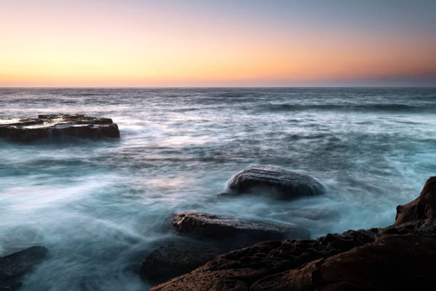 istock Rocky Sunrise Seascape 945062052