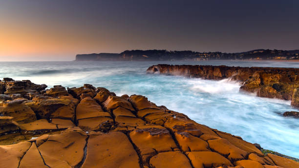 istock Rocky Sunrise Seascape 945062070