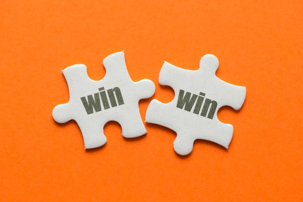 istock The word win win on two matching puzzle on orange background 945063002