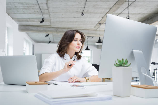 istock Businesswoman working on laptop in office 945065462