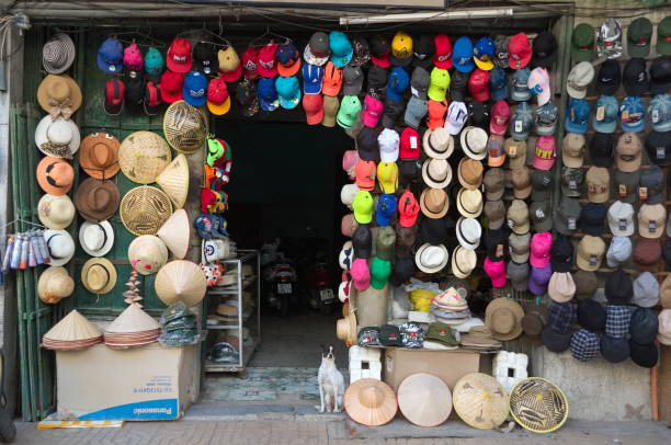 Hat shop in Hanoi, Vietnam. Big variation of colorful hats on the street.