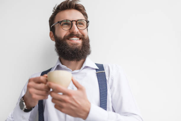 istock Cheerful businessman with cup of coffee 945068170