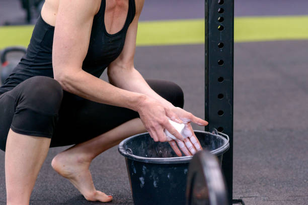 istock Fit young woman chalking her hands 945069806