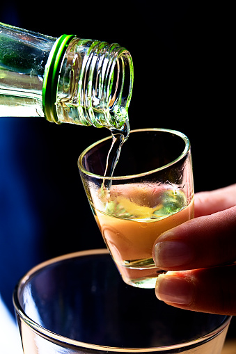 Pouring alcohol shot