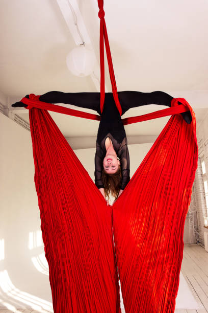 istock Girl training on aerial silks 945073166