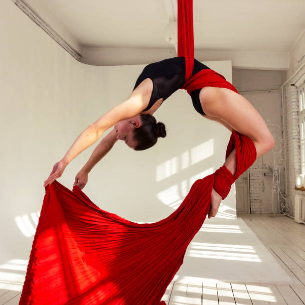 istock Girl training on aerial silks 945073642