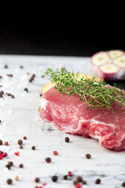 istock Raw pork meat with spice ingredient 945073866