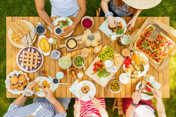 istock Vegan friends eating fruits 945078096