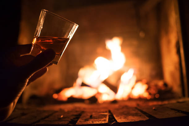 istock Whiskey glass with bonfire background crop 945078728
