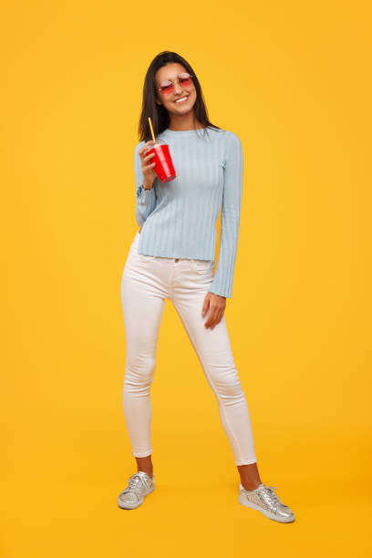 istock Cheerful woman with plastic cup 945078792