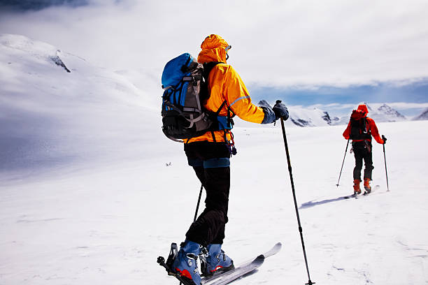 alpine touring skiers stock photo