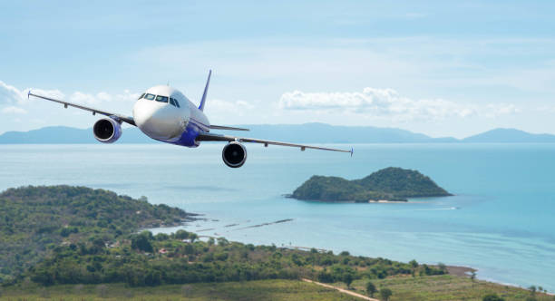 istock Airplane with beautiful ocean and island in background, explore the world 945081976