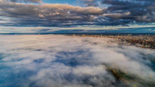 istock Riga city Autumn Drone flight above and sunrise above clouds 945088322