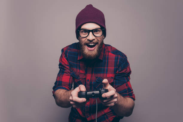 Excited happy hipster man playing video game