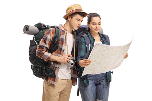 Teenage tourists looking at a map