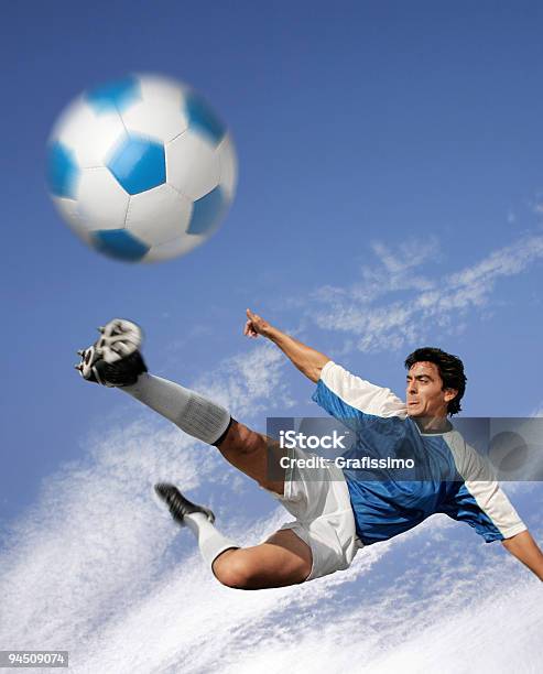 Blue Sky Over Best Soccer Player Hitting The Ball Stock Photo - Download Image Now - 25-29 Years, Adult, Adults Only