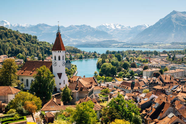 Thun cityspace with Alps mountain and lake in Switzerland Thun cityspace with Alps mountain and lake in Switzerland village stock pictures, royalty-free photos & images