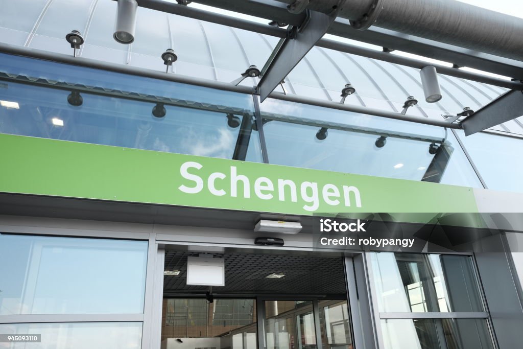 Schengen writing on airport arrivals Schengen Agreement Stock Photo