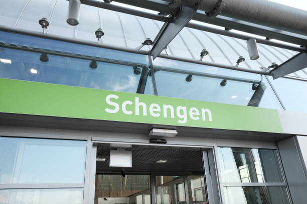 Schengen writing on airport arrivals Schengen writing on airport arrivals schengen agreement stock pictures, royalty-free photos & images