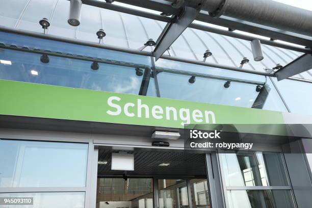 Schengen Writing On Airport Arrivals Stock Photo - Download Image Now - Schengen Agreement, Outer Space, Airport