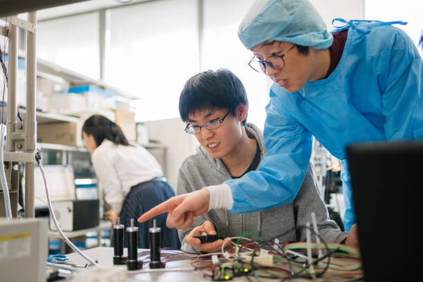istock Engineering students working with a medical student to design machinery for surgery 945093292