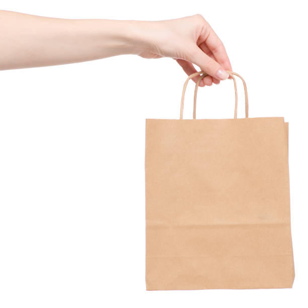 istock Paper package in hand buy sale sold 945093526
