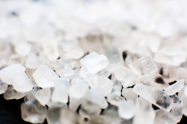 Crystals of salt crystals on dark background. Macro shot.