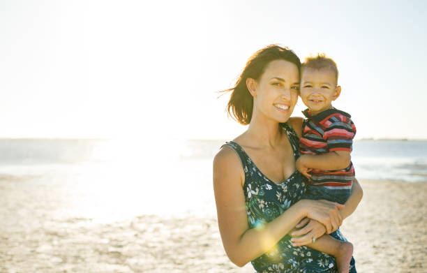 istock Mother and son having fun in the sun 945093860