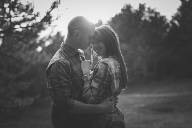istock Happy couple at sunset in the forest 945093918
