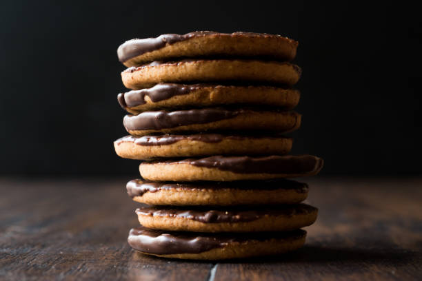 istock Stack of Chocolate Covered Round Jaffa Cookies / Whole Wheat. 945094110