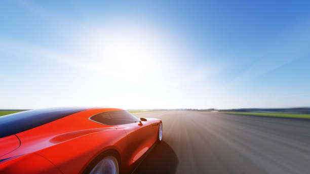 istock red car driving on a road 945094842