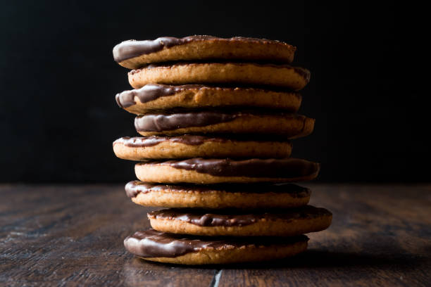 istock Stack of Chocolate Covered Round Jaffa Cookies / Whole Wheat. 945097020