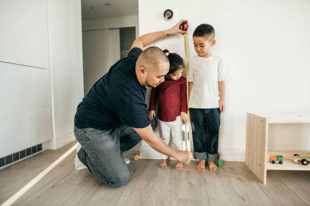 istock Teaching Kids How to Take Body Measurement 945097306
