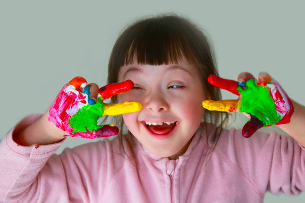 istock Cute little girl with painted hands 945097574
