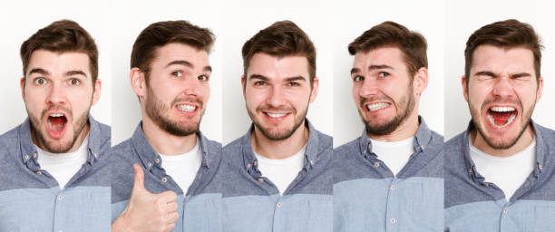 istock Set of young man different emotions at white studio background 945098012