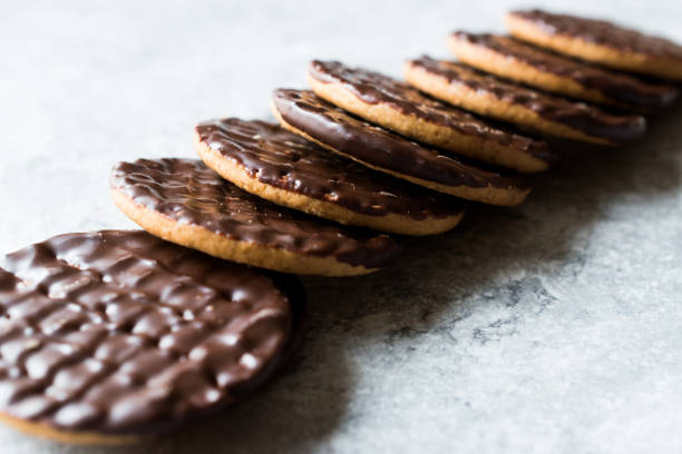 istock Stack of Chocolate Covered Round Jaffa Cookies / Whole Wheat. 945098308