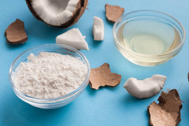 istock Plate with coconut flour and water on blue background 945104274
