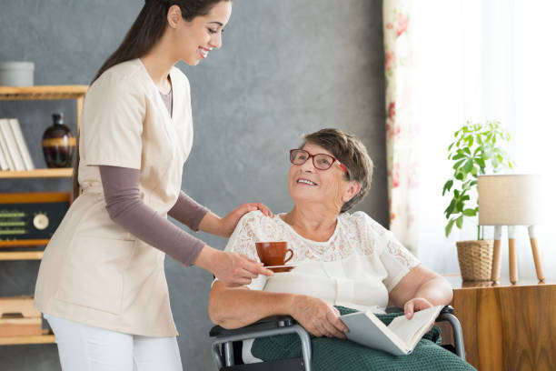 istock Young nurse and elderly woman 945106986